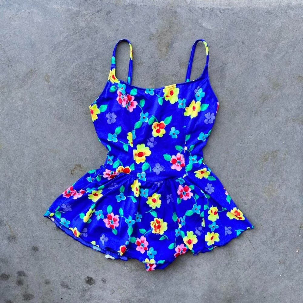 80s neon one piece swimsuit with bright blue and yellow floral pattern